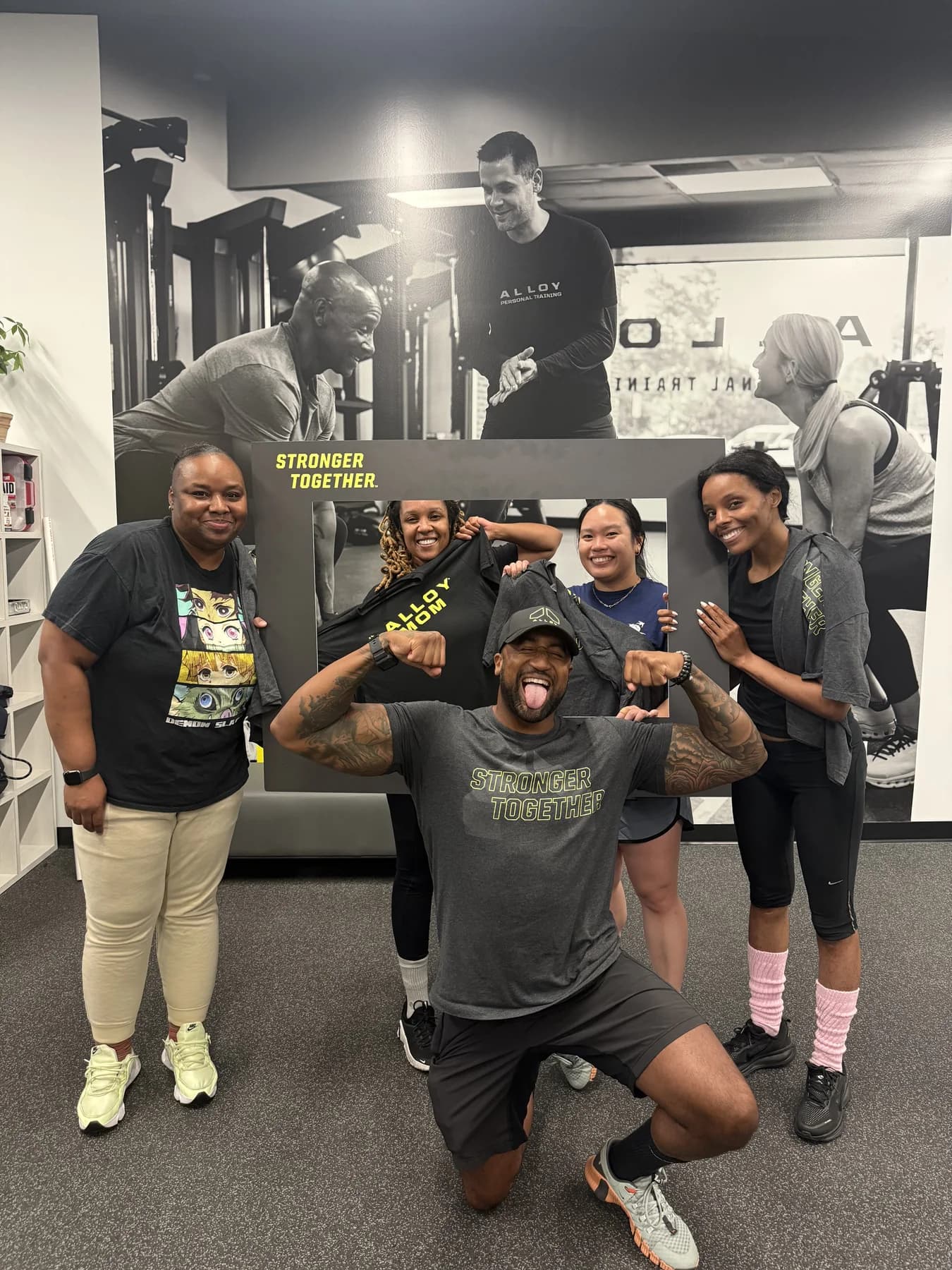 A group of Alloy members celebrating together in the studio