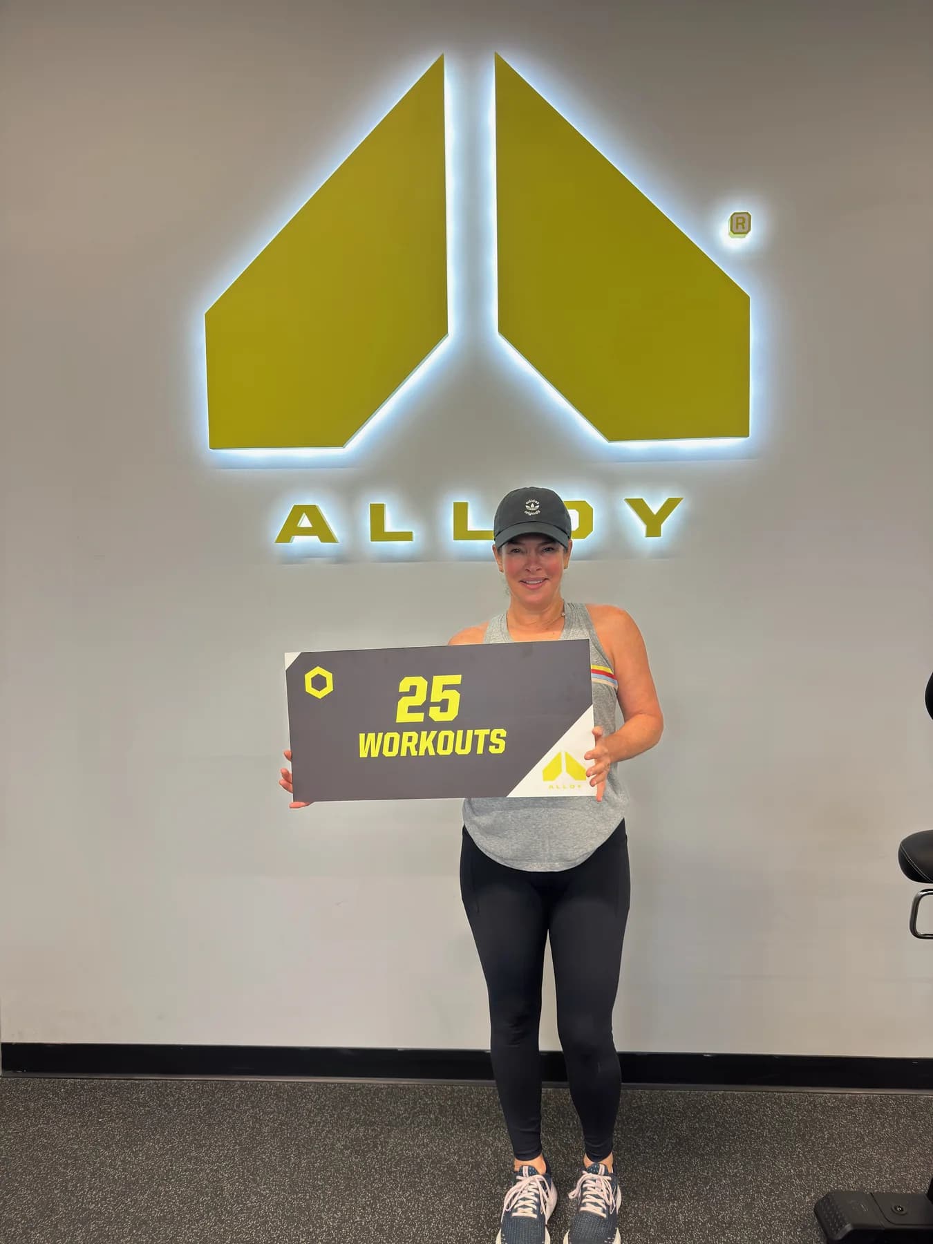 A member celebrating twenty-five completed workouts