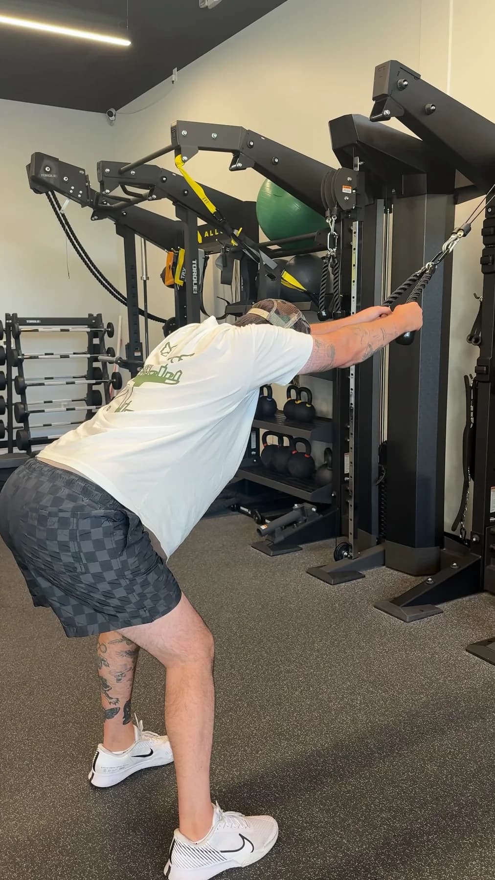 A member working through a single-arm cable exercise