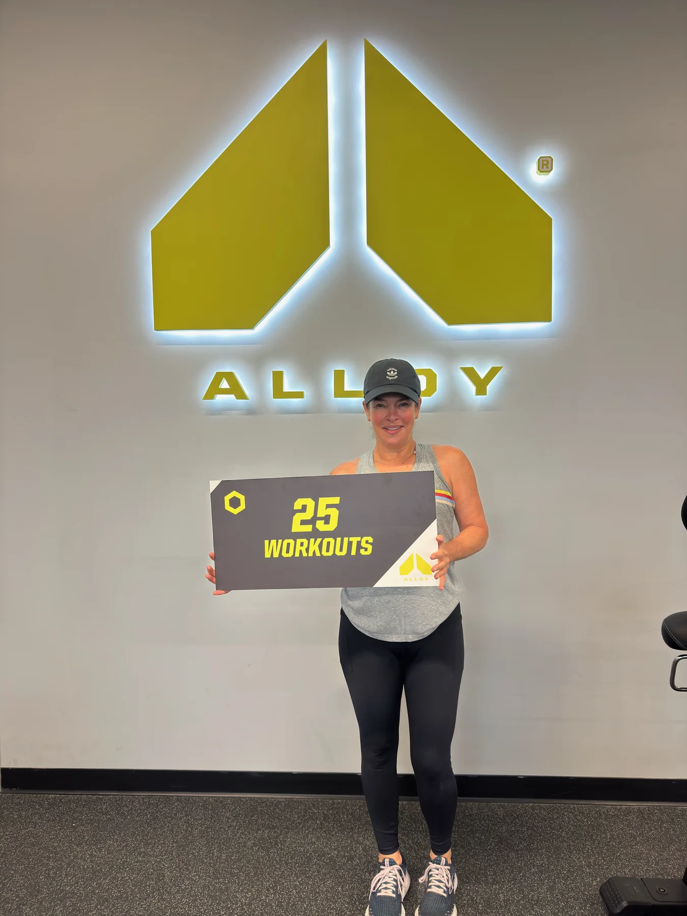 A member celebrating twenty-five completed workouts